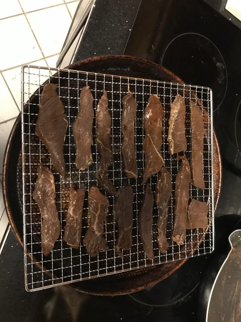 Beef jerky properly spaced on the dehydrator tray