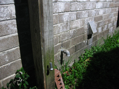 Post hinge for a fence gate; photo © Kelly Smith