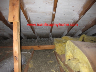 Loose fill attic insulation and fiberglass batts