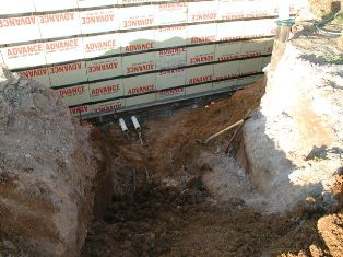 Geothermal heat pump connection in a new home foundation