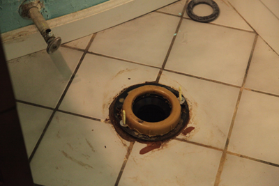 A toilet wax ring mounted in the flange; photo courtesy Kelly Smith